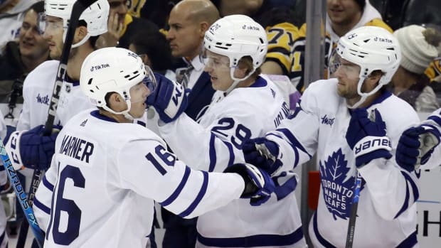 Nov 15, 2022; Pittsburgh, Pennsylvania, USA; Toronto Maple Leafs right wing Mitchell Marner (16) celebrates his goal with the Toronto bench against the Pittsburgh Penguins during the first period at PPG Paints Arena. Mandatory Credit: Charles LeClaire-USA TODAY Sports